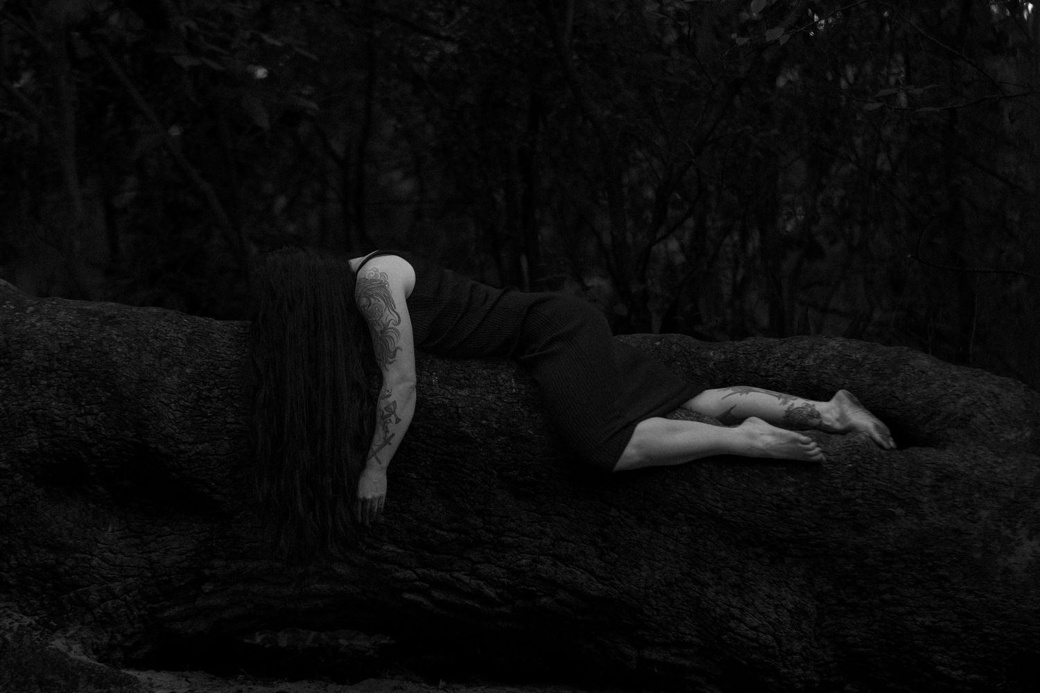 Black and white artistic photo series of nude figures reclining on natural forms in a minimalist style.