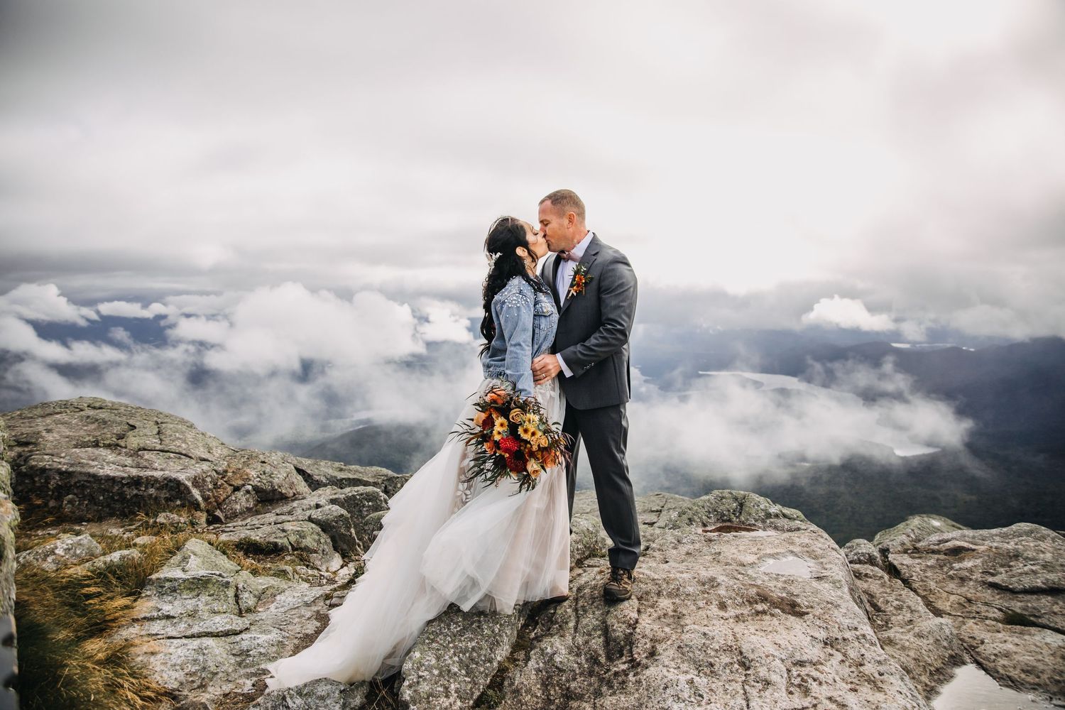 couple eloping on whiteface mountain in the fall foliage