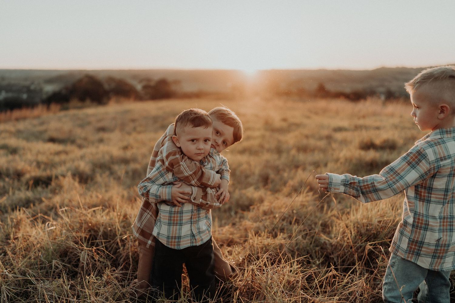 Family playing together in a field in Picton NSW