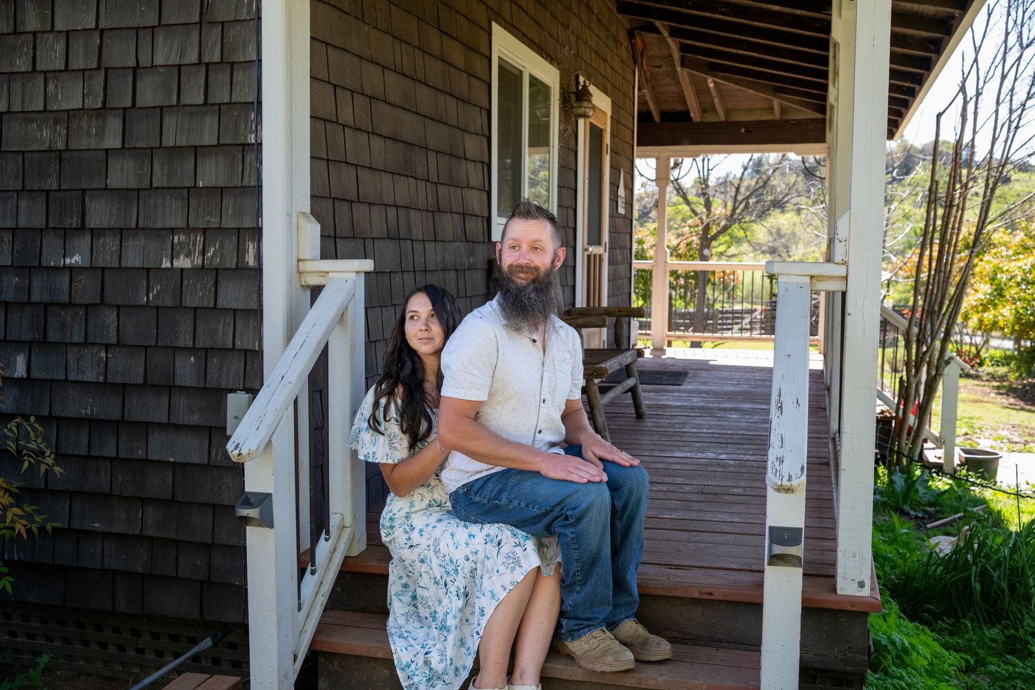 A sequence of romantic engagement photos captured on a rustic wooden porch during a sunny afternoon.