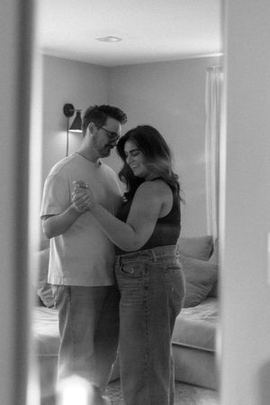 Intimate black and white photographs showing tender moments between a couple.