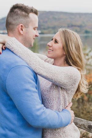 Series of romantic engagement photos showing a couple embracing against a scenic mountain backdrop.