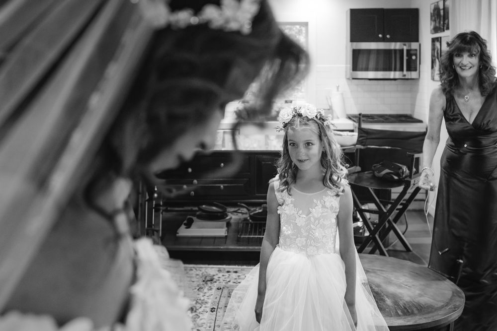 A collection of black and white wedding photographs arranged in a horizontal filmstrip-style layout.