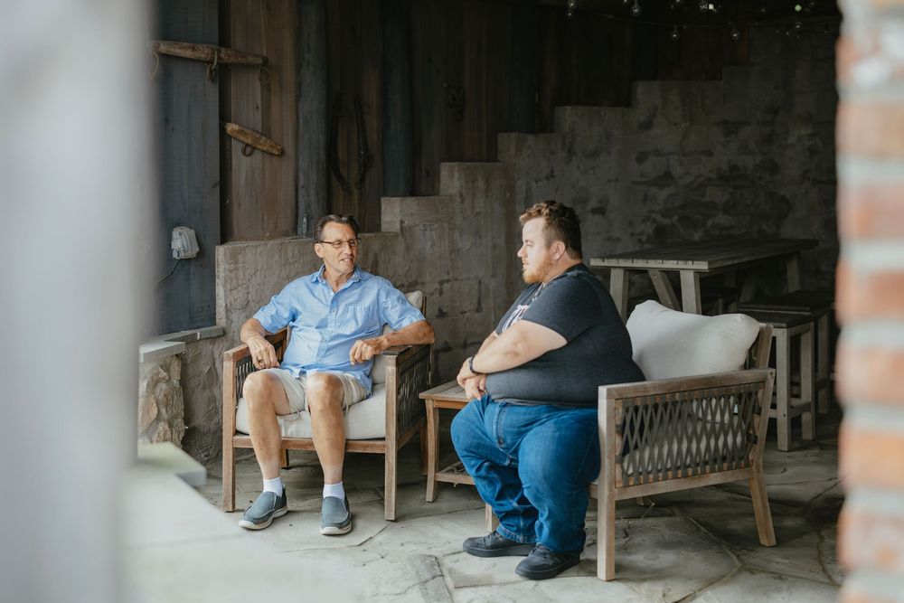 People sitting on a wooden bench in a rustic porch setting, shown in a series of progressive images.