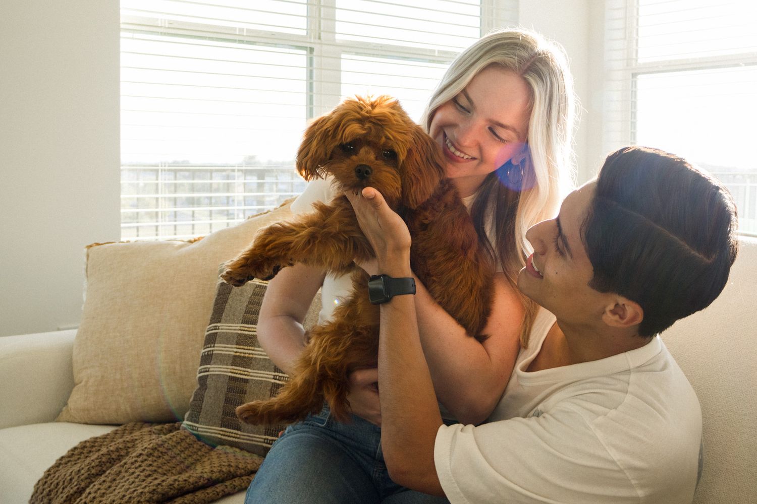 couple holding dog
