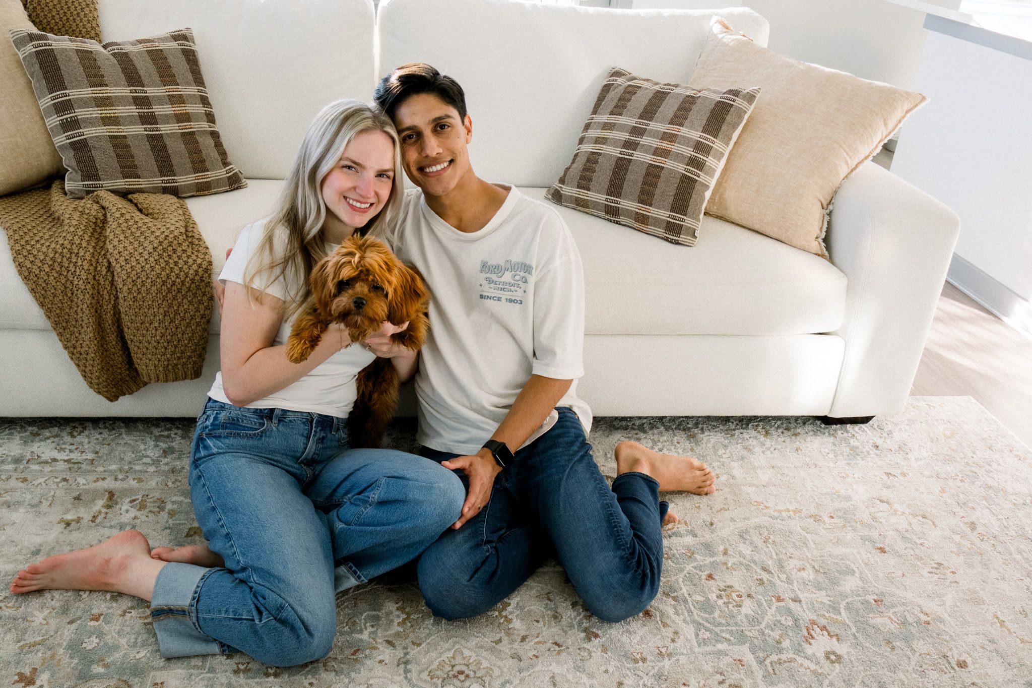 couple holding dog