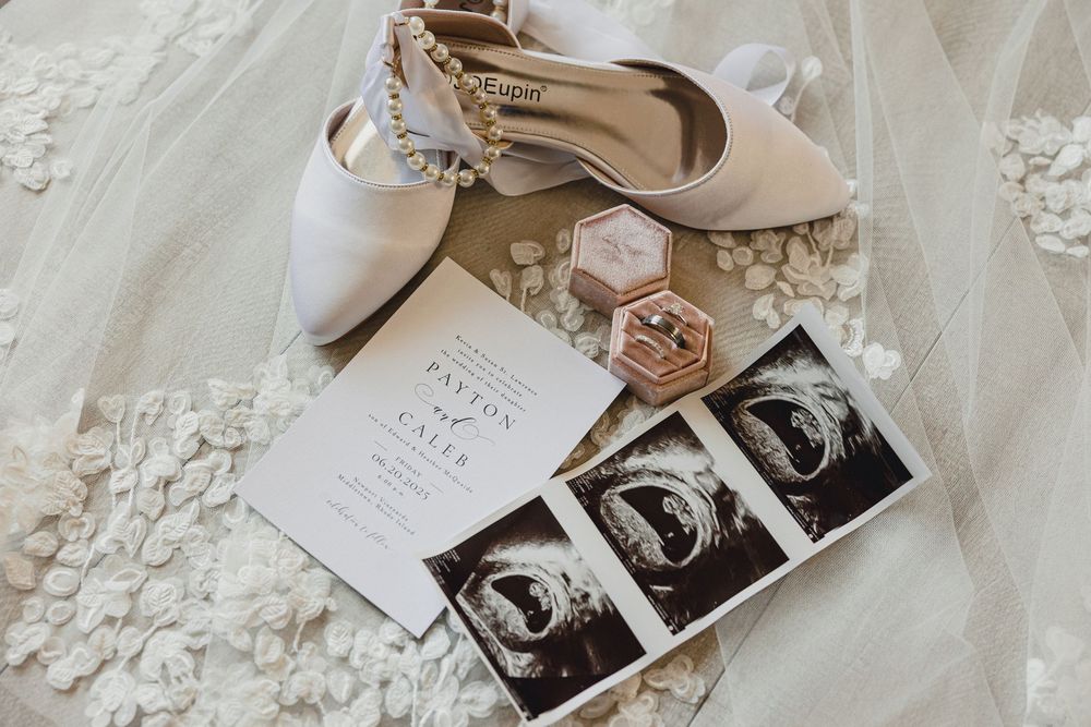 Black and white vintage style wedding photos displayed with delicate lace and floral decor.