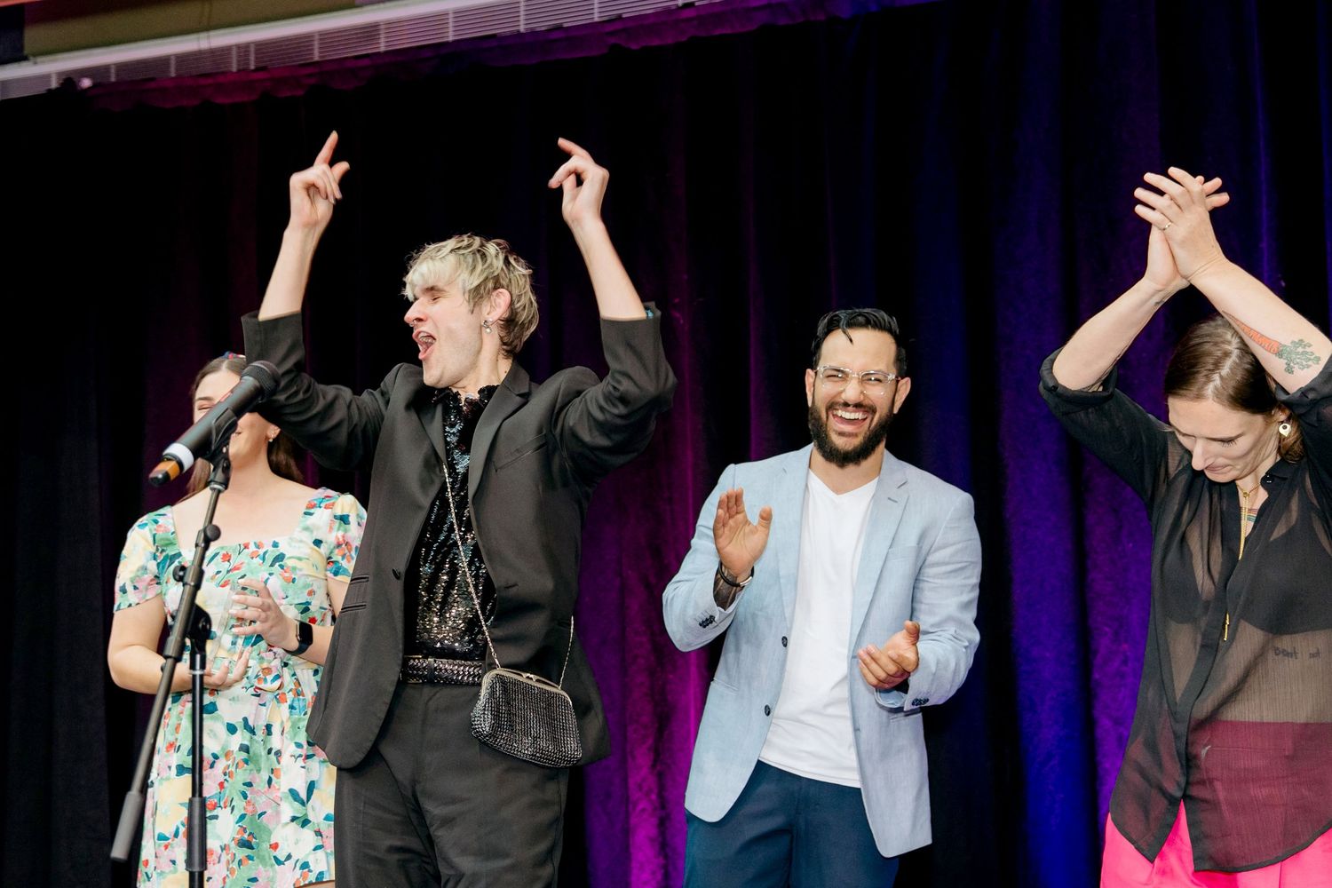 Film festival award winner on stage celebrating when presented with award