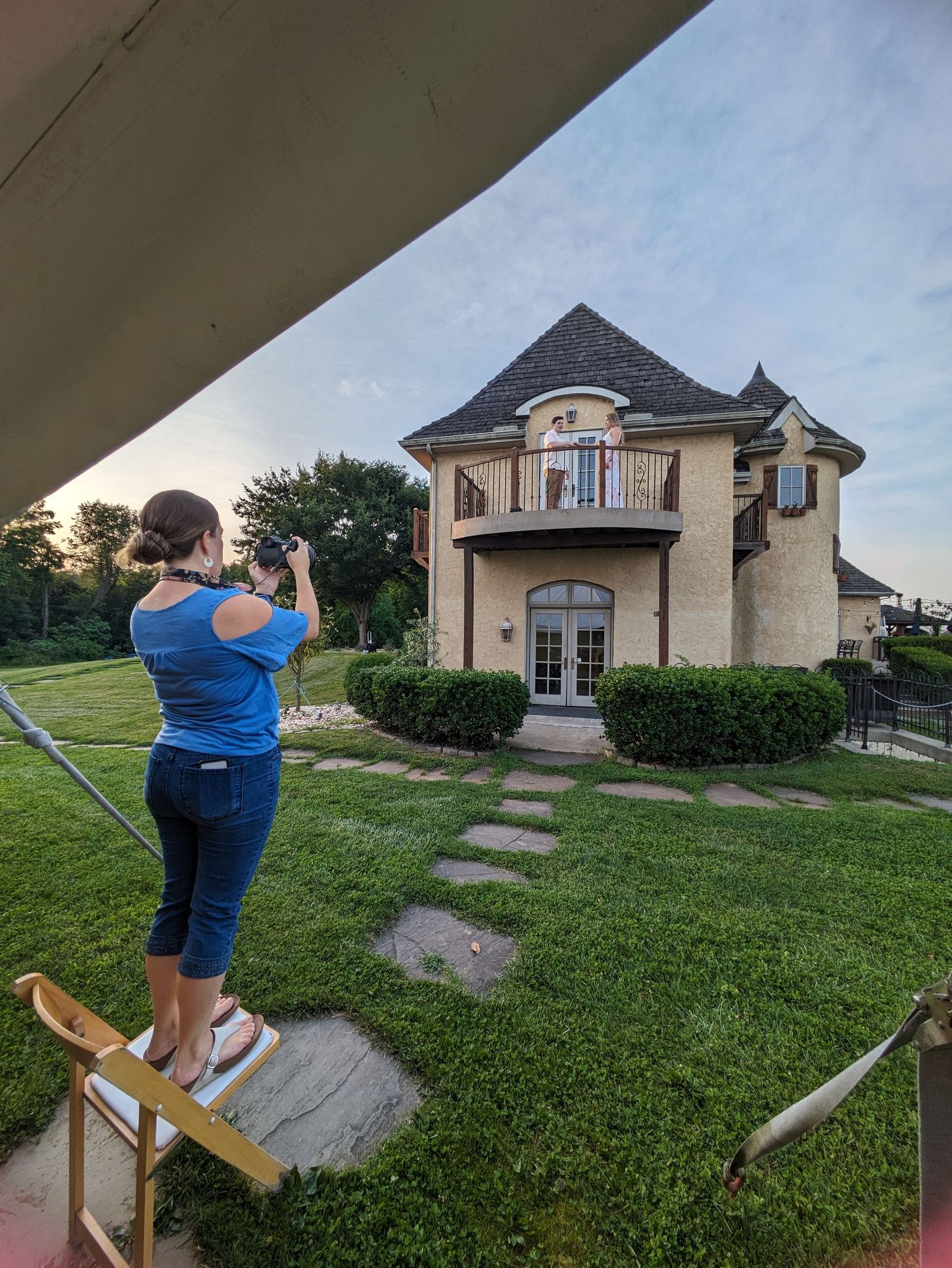 A sequence of photos showing someone in a blue shirt taking pictures of a beige house with a black roof at sunset.