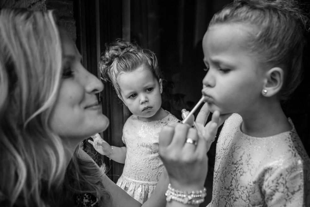 Intimate black and white portrait capturing tender family interaction.