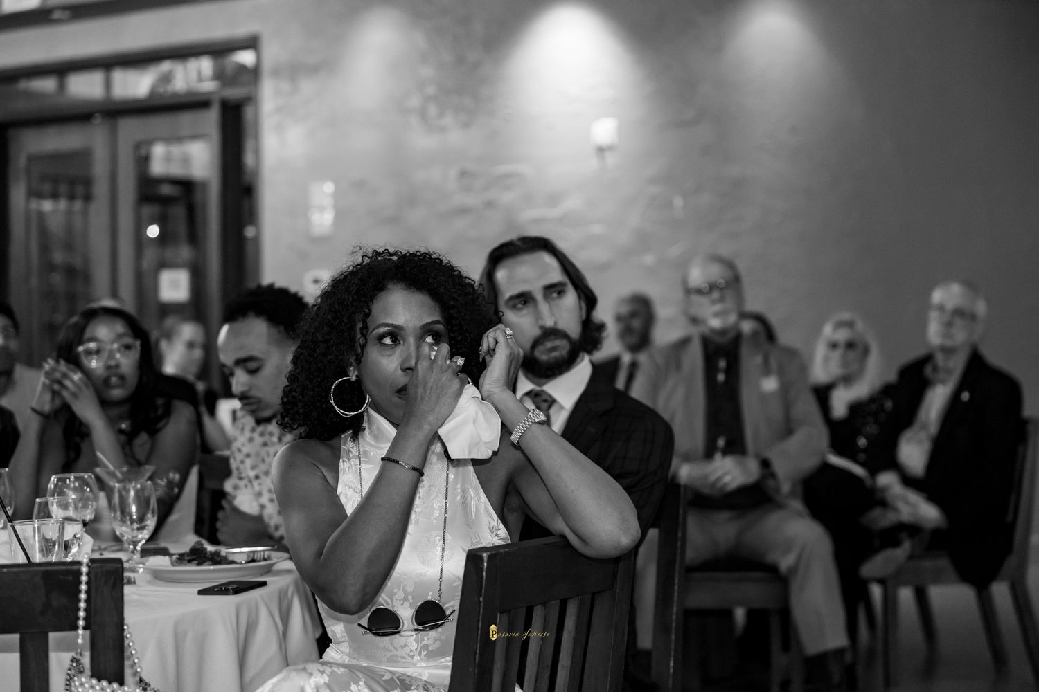 Black and white photo of Nick Wright and Byrd Wright wedding rehearsal looking emotional.