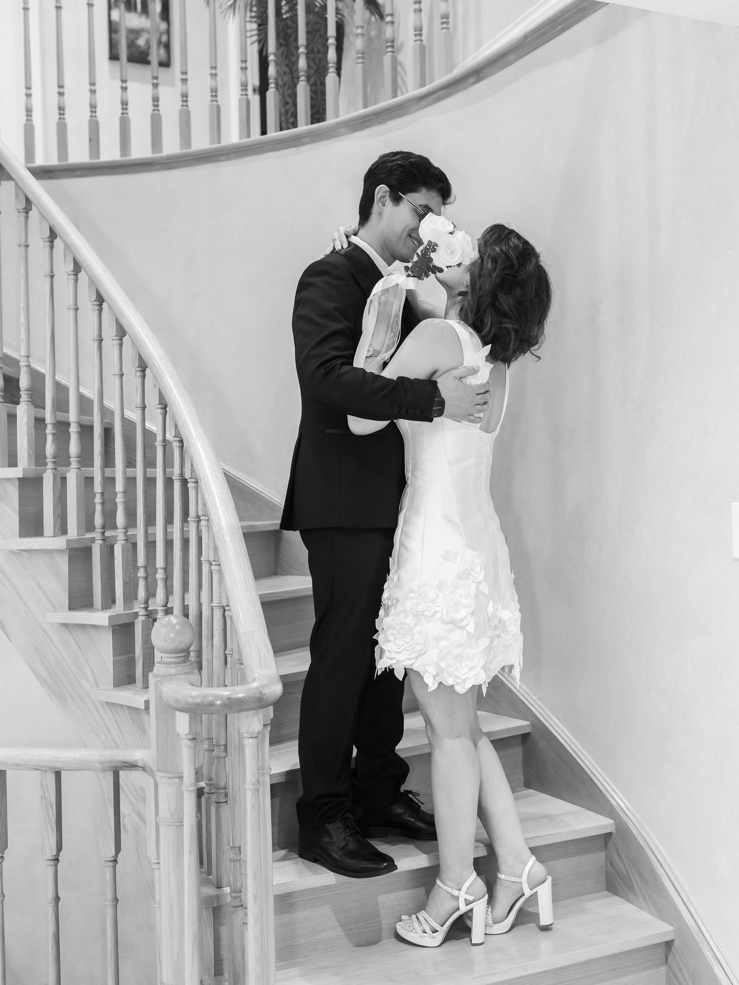 Couple sharing a kiss during a romantic indoor portrait session