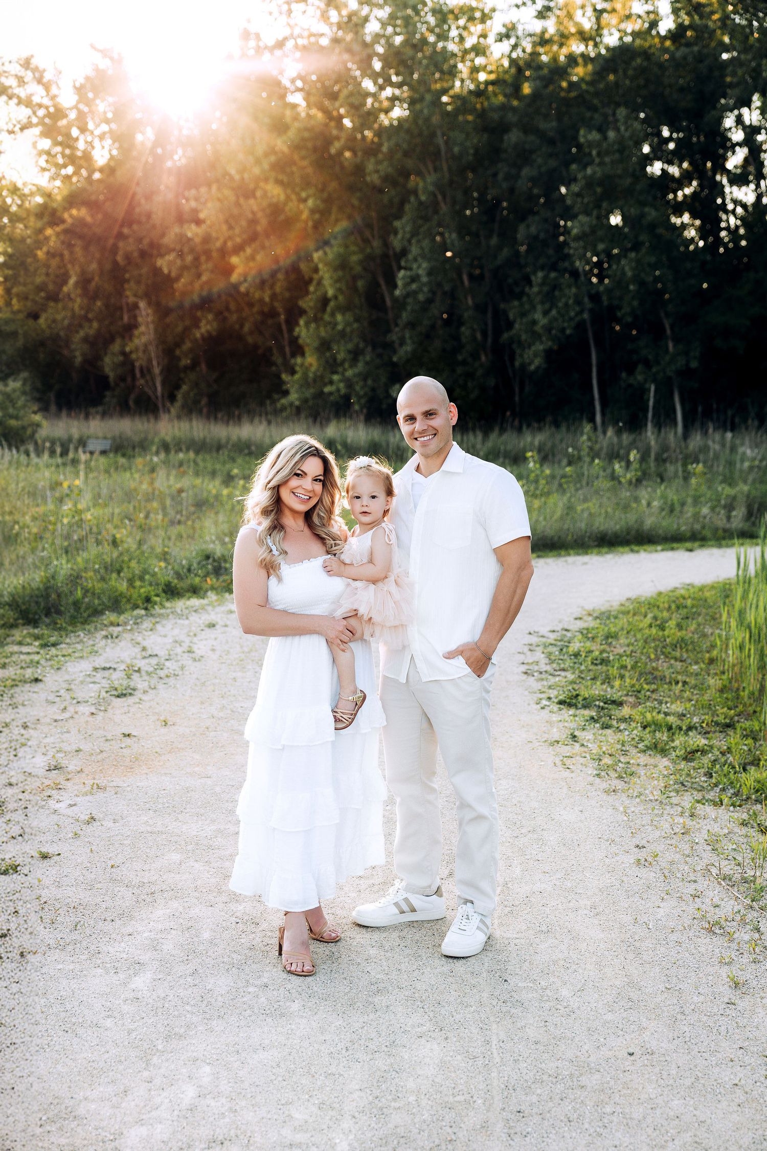 outdoor family session for a family of three, dresses in neutral timeless outfits
