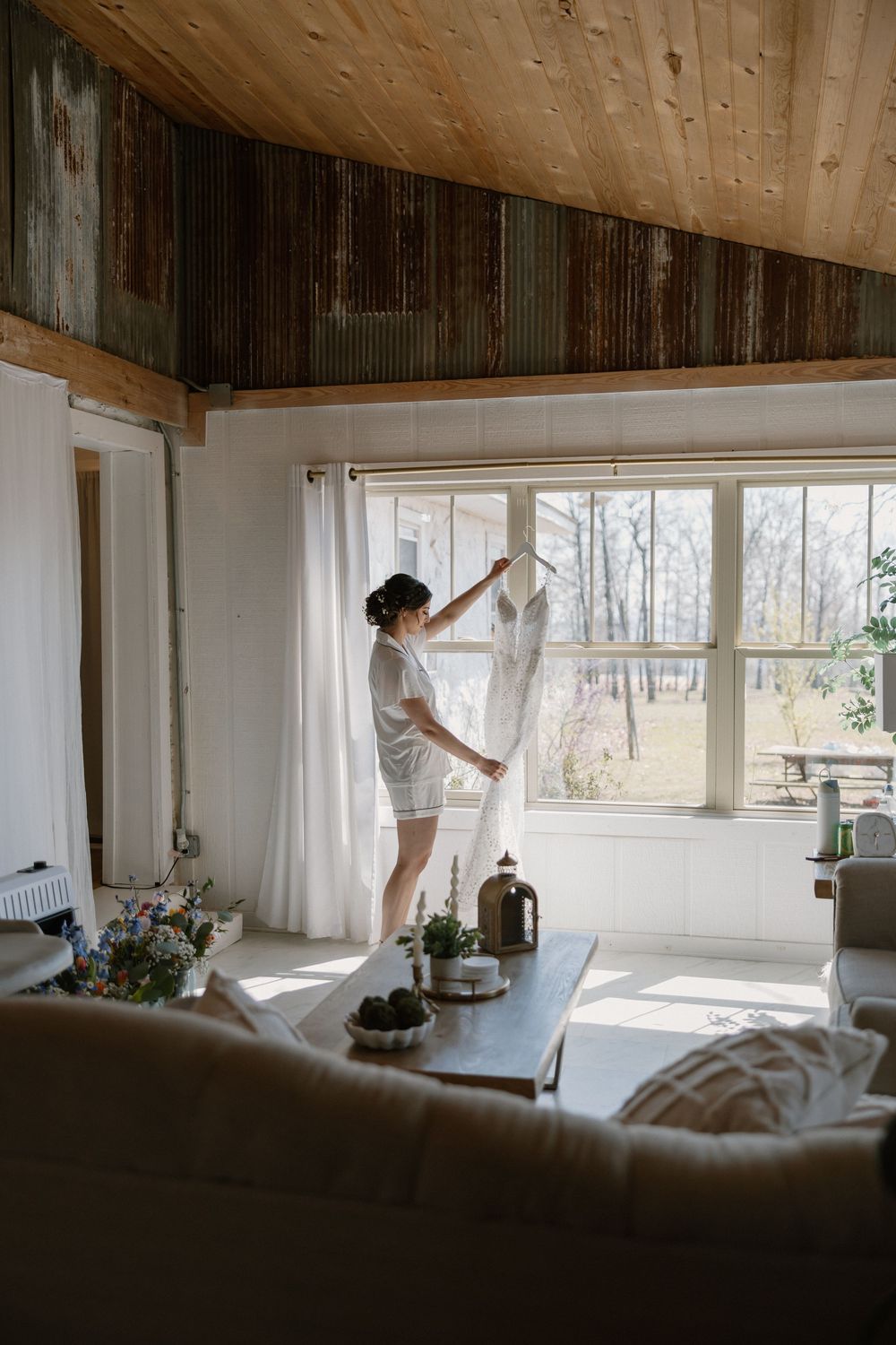 A sequence of images showing a person in white clothing dancing gracefully through a sunlit room with sheer curtains.