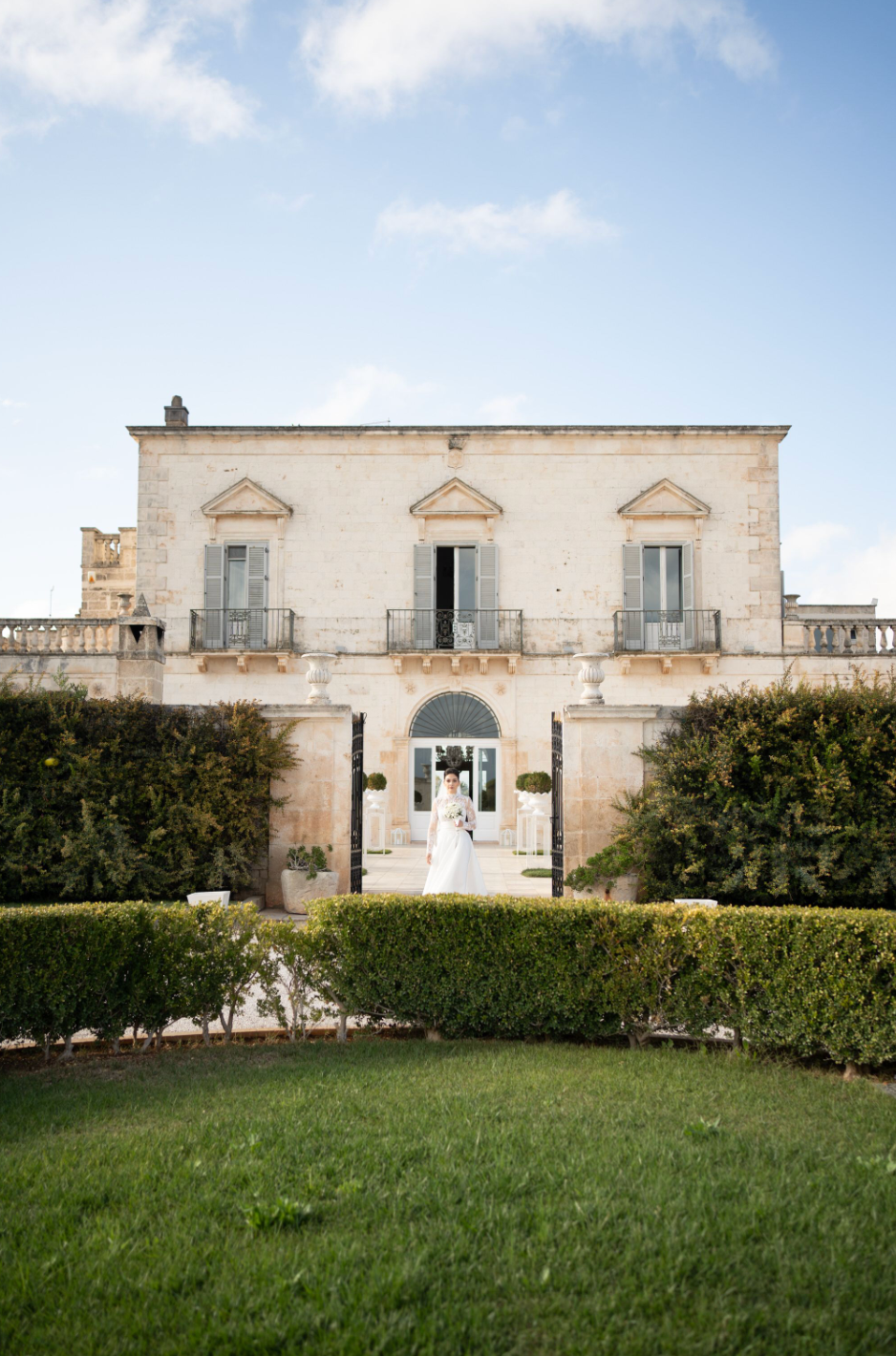 Bride in traditional masseria courtyard in Puglia, Italy
