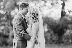 Black and white wedding photo collage showing romantic moments between a couple in formal attire outdoors.