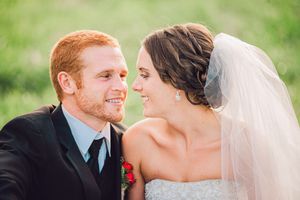 A couple in wedding attire shares intimate moments across multiple photos outdoors with blurred green foliage in background.