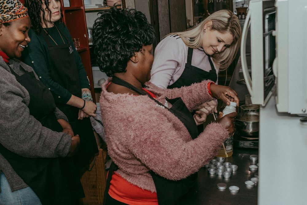 Group of tourists enjoying the artisan workshop at Natura Africa
