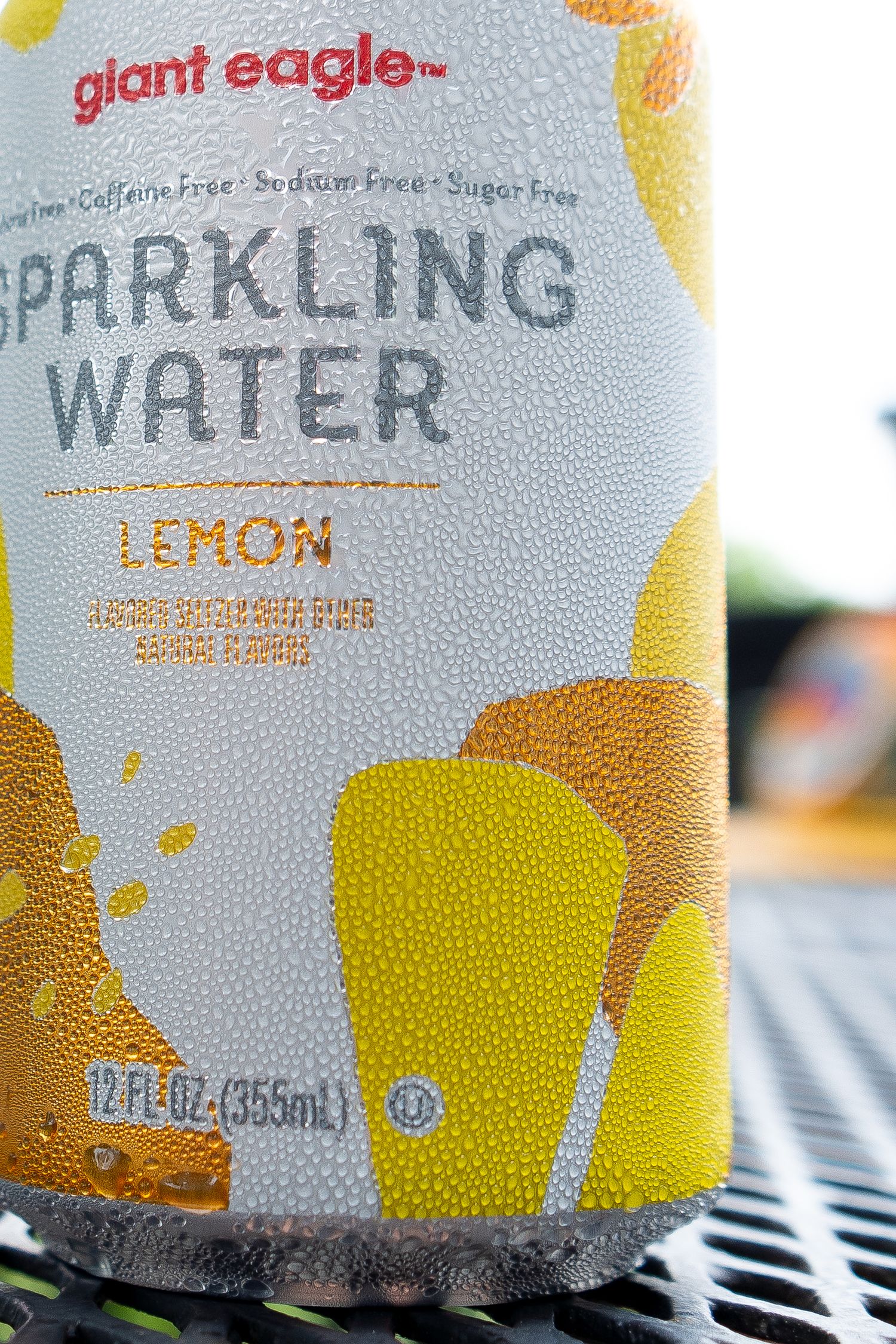 Close up view of a Giant Eagle lemon sparkling water can with condensation.