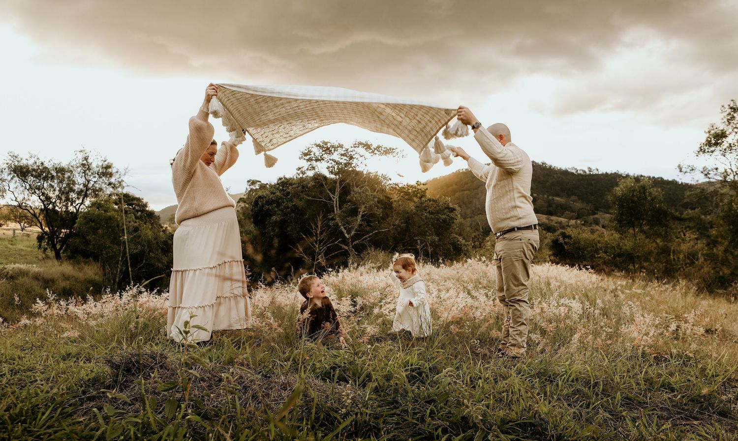 A family playing a game during a outdoor photo session