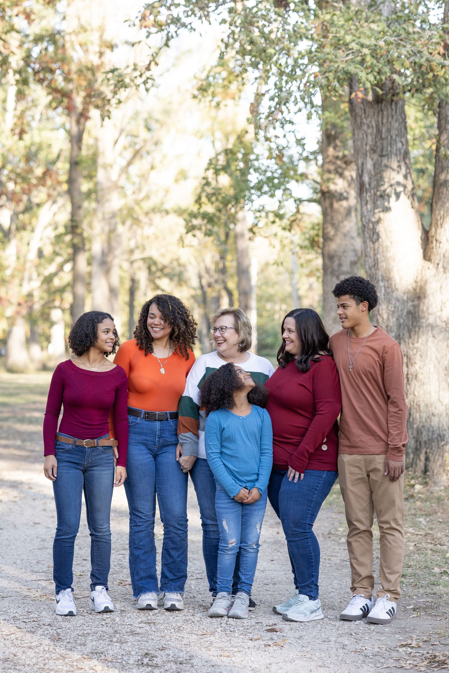 Springfield, IL family photographer captures an extended family laughing together during a photo session in Central, IL