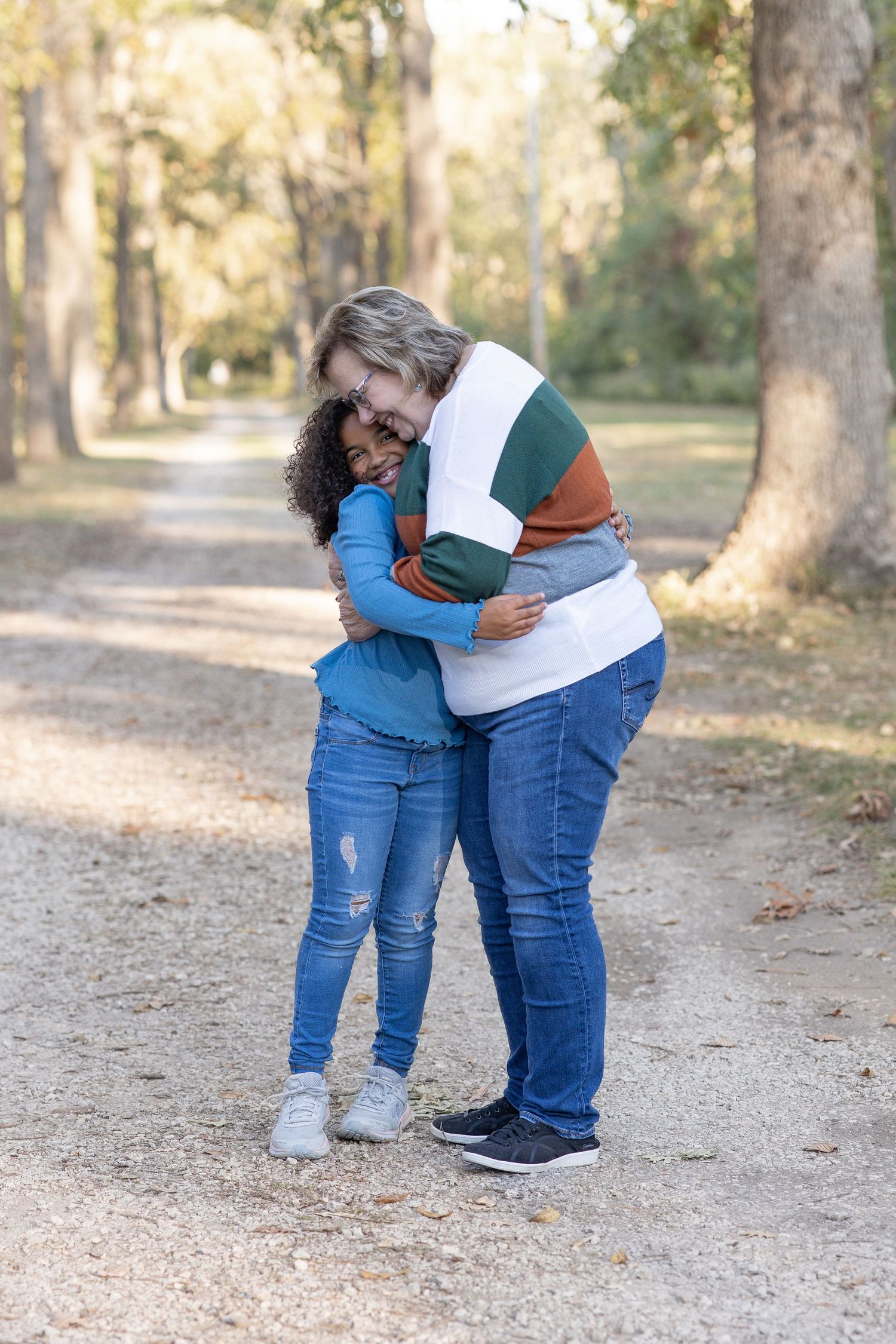 Springfield, IL family photographer captures a granddaughter hugging her grandmother during a photo session in Central, IL