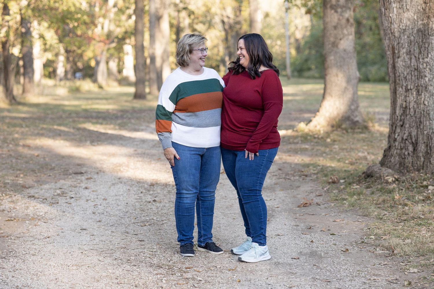 Springfield, IL family photographer captures an adult daughter smiling with her mother during a photo session in Central, IL