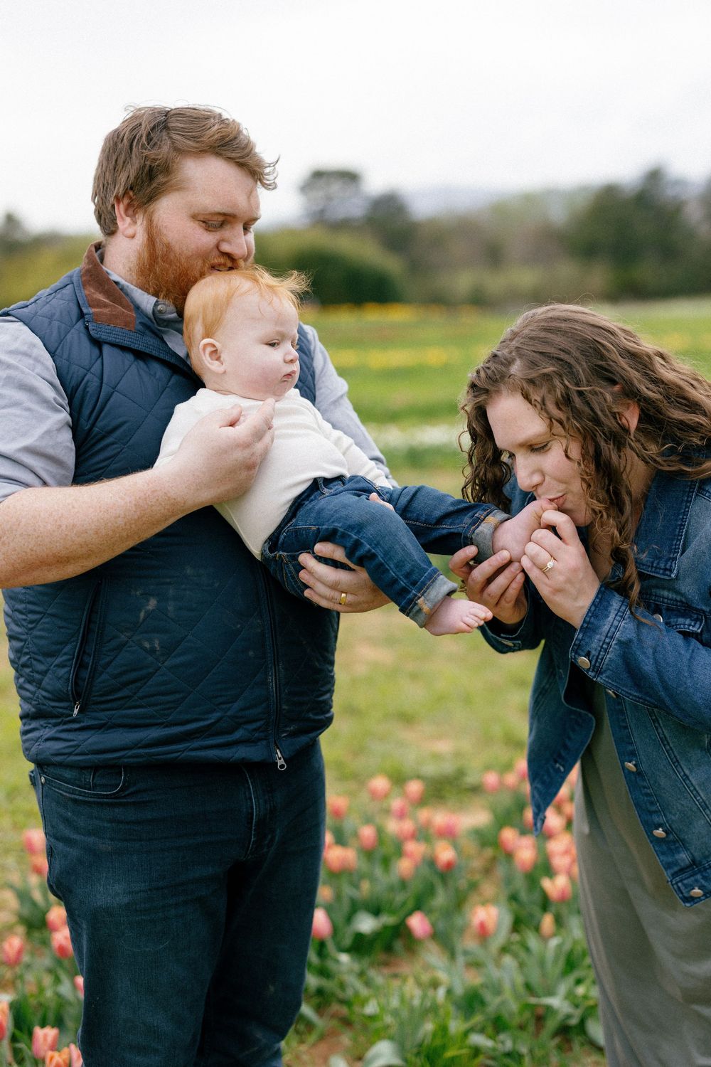 A sequence of tender moments in a flower field with denim jackets against a natural outdoor backdrop.