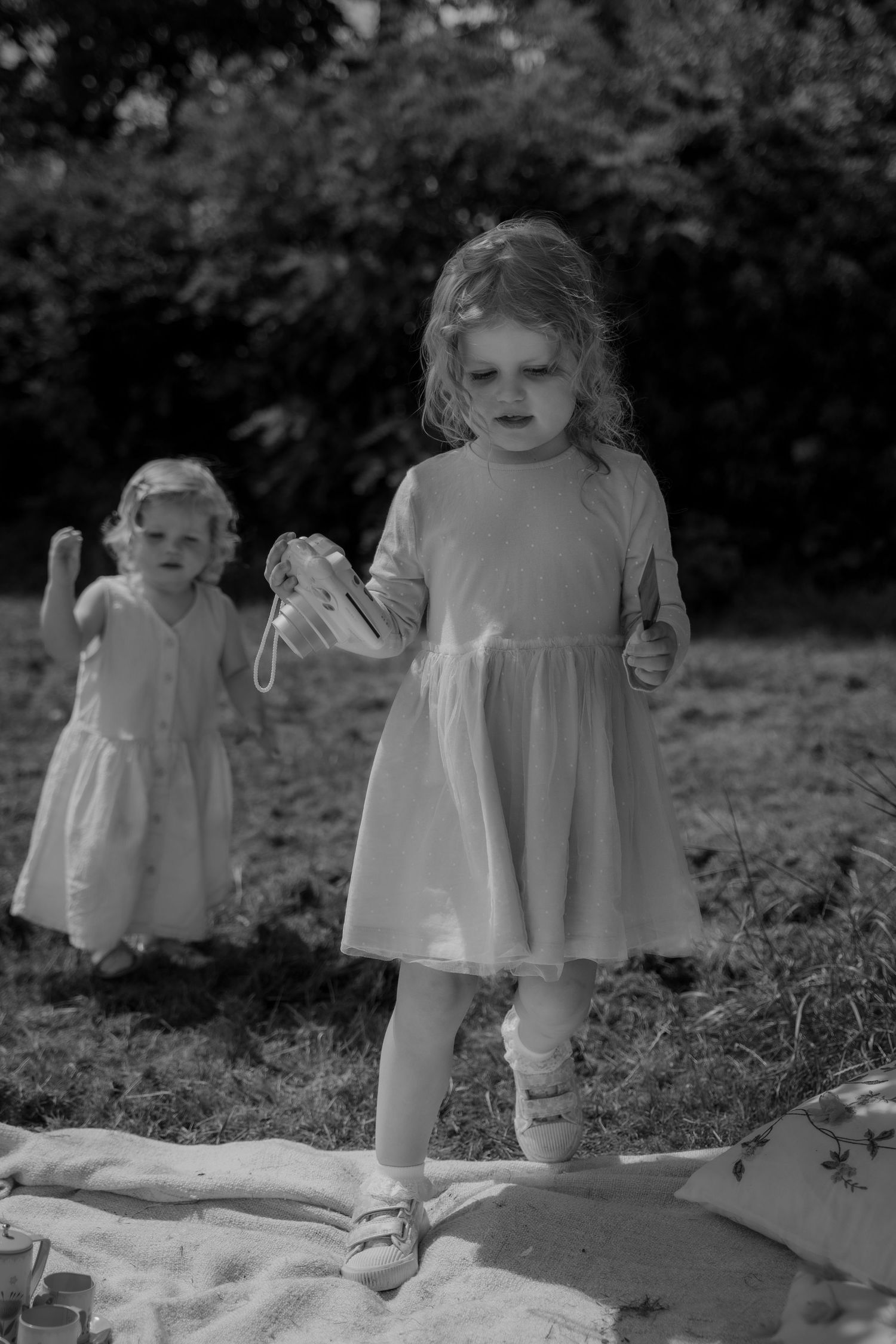Little hands reaching for mum, laughter echoing—authentic connection captured during a relaxed family shoot in Derbyshire.