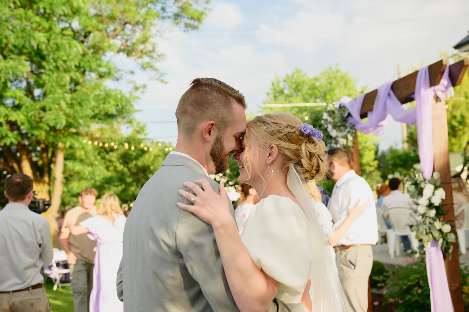 Blackfoot wedding photographer ShutterGirl dancing candid at backyard wedding in Blackfoot idaho