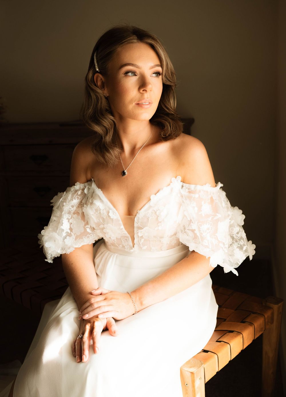 Natural light bridal portrait by window at Holmes Mill, captured by Manchester wedding photographer with editorial documentary style.