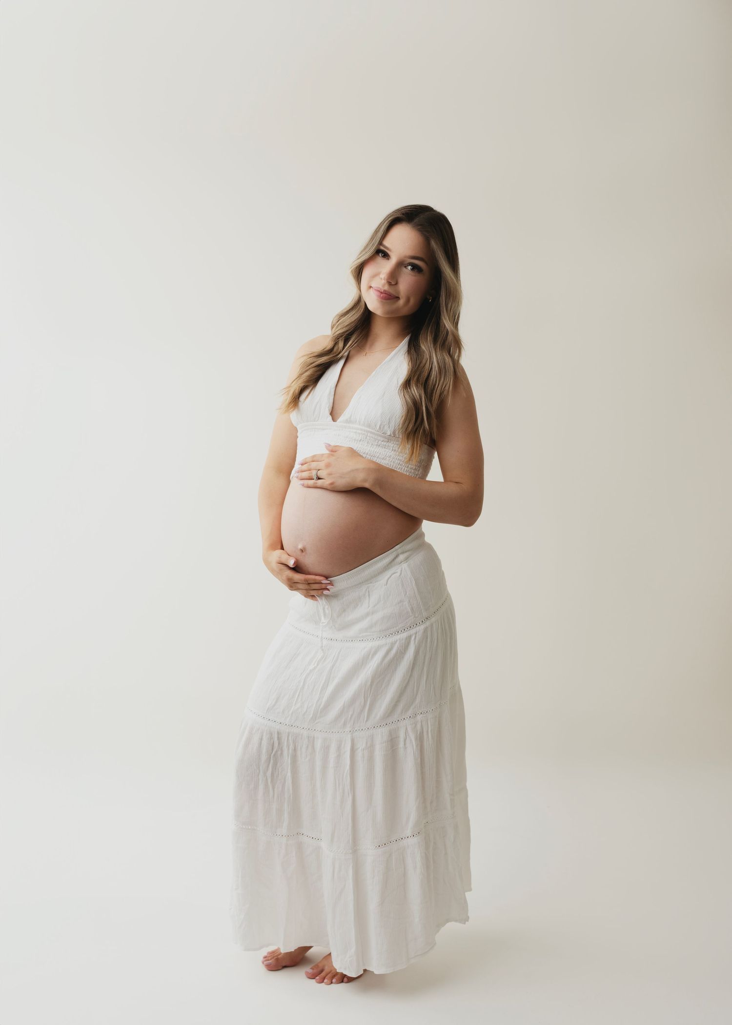 Lindsay a gorgeous mom to be so beautiful and radiant during her maternity photos with Elizabeth Lang Photography. a sensual couples photo.