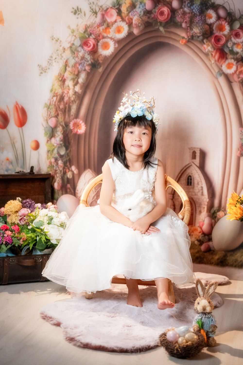 Joyful Easter mini session featuring kids and family portraits with a beautiful spring floral backdrop, captured by an Auckland family photo