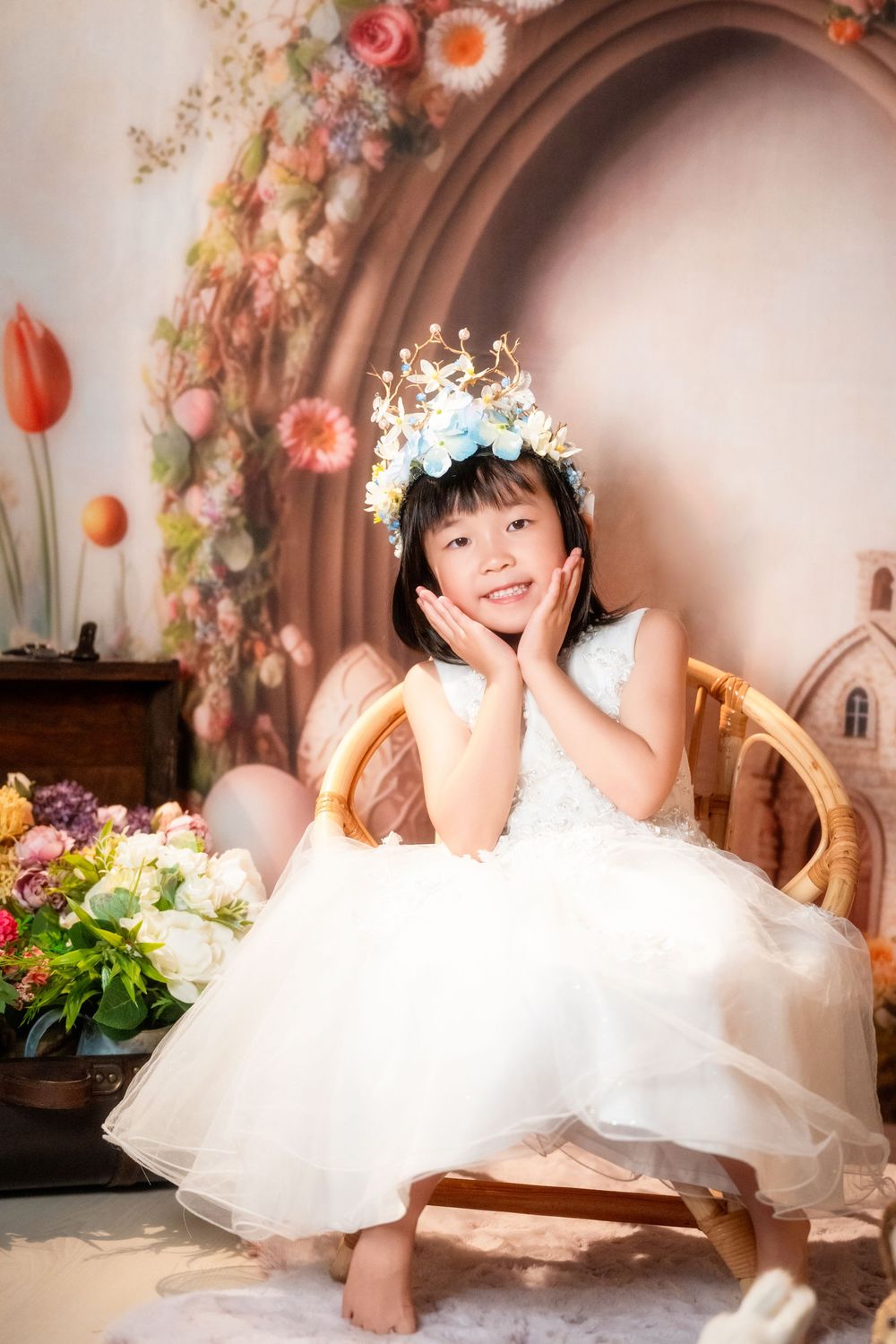 Joyful Easter mini session featuring kids and family portraits with a beautiful spring floral backdrop, captured by an Auckland family photo