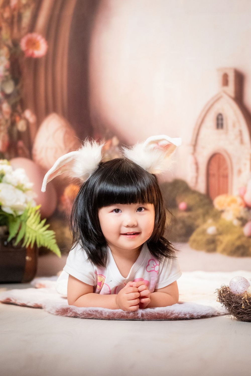 Joyful Easter mini session featuring kids and family portraits with a beautiful spring floral backdrop, captured by an Auckland family photo
