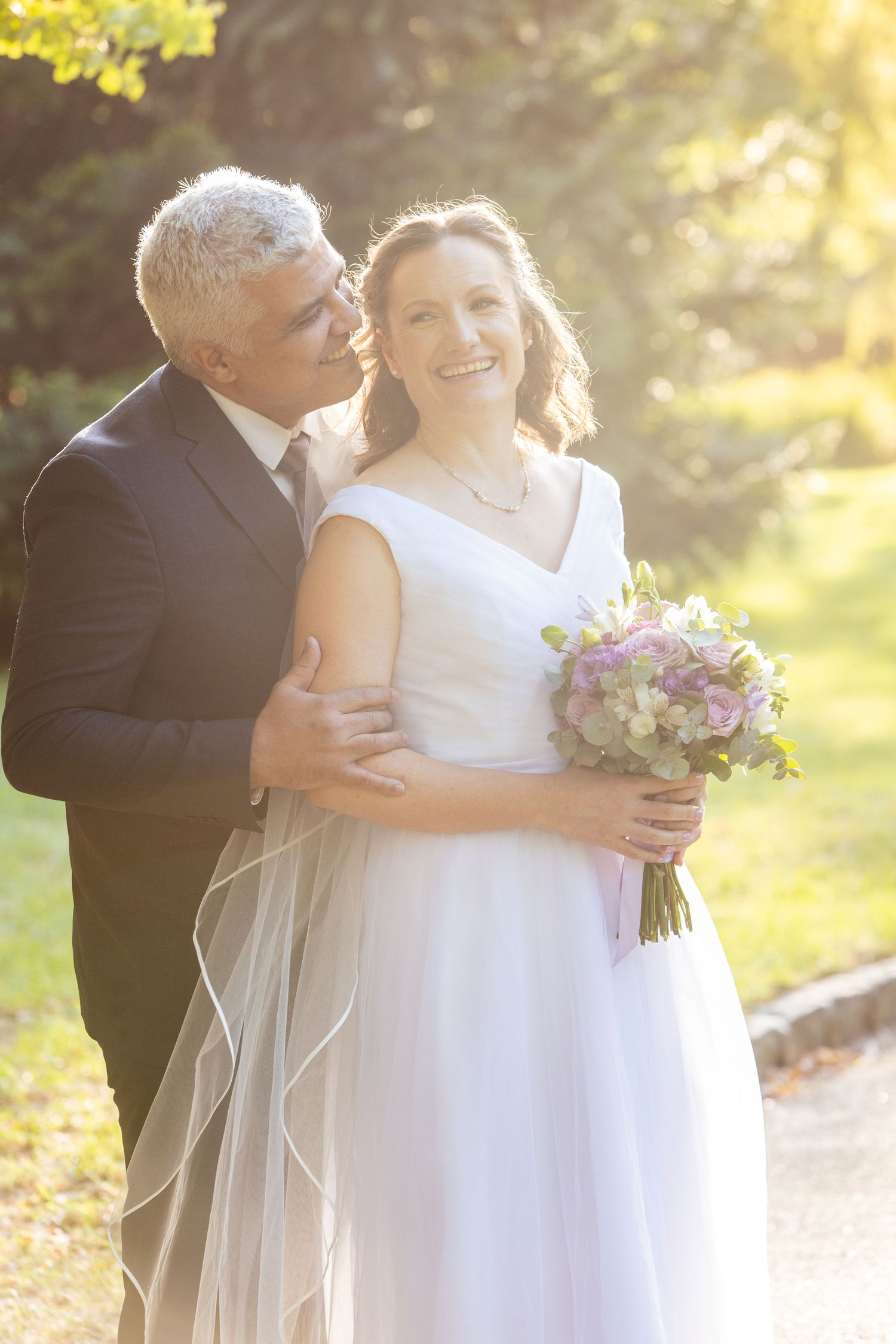 Wedding couple at golden hour, romantic moment in Melbourne shoot.