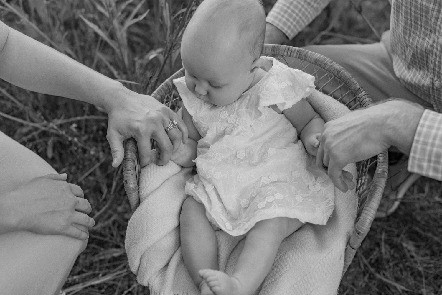 Family with baby at Cedar Ridge Tree Farm field in Gilbert, SC