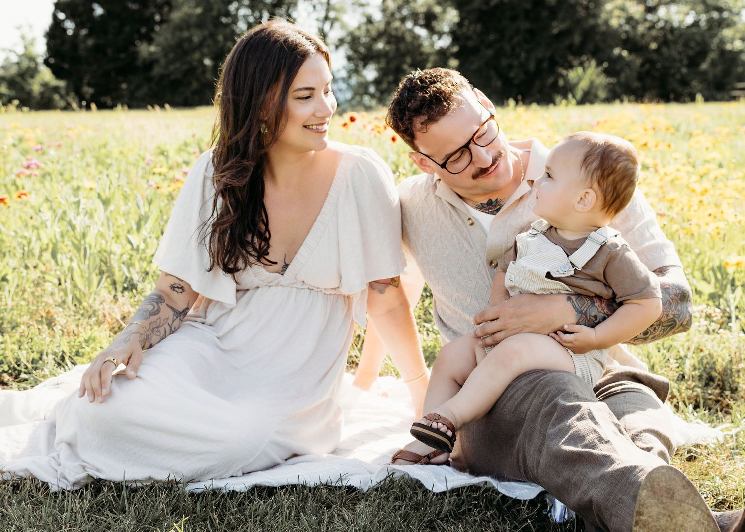 Parents cuddling with their baby during a South Jersey family photography session.