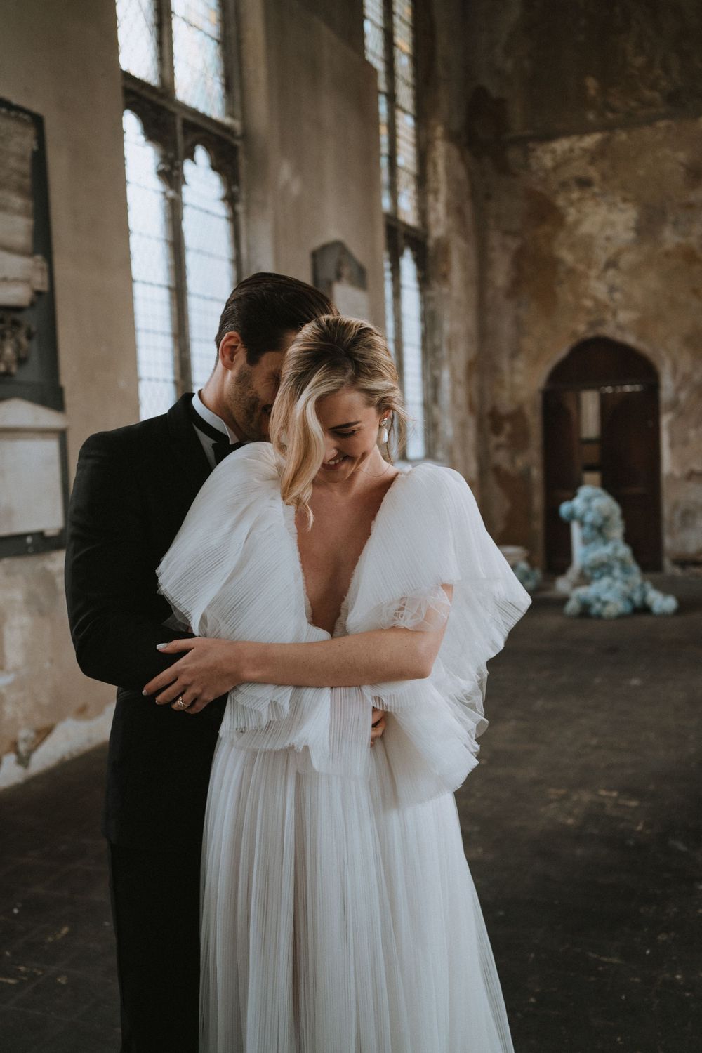 bride and groom laughing together, bride wearing tulle wedding ballgown
