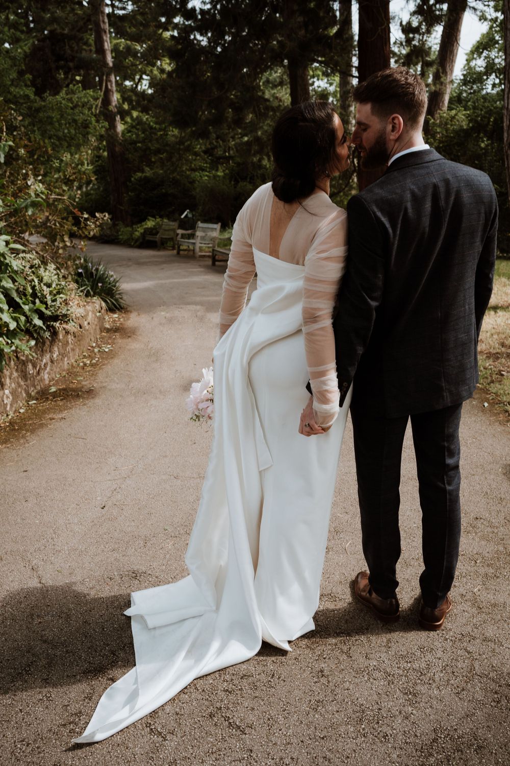 bride and groom kiss, bride wearing tulle wedding dress