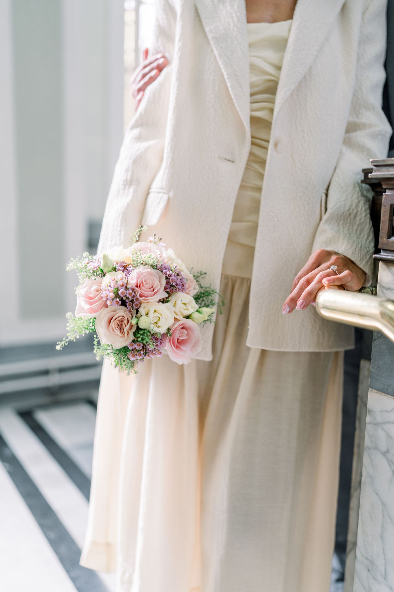 Bride & groom walking together through a Central London park on their relaxed spring-summer wedding day, captured in a light & airy style.