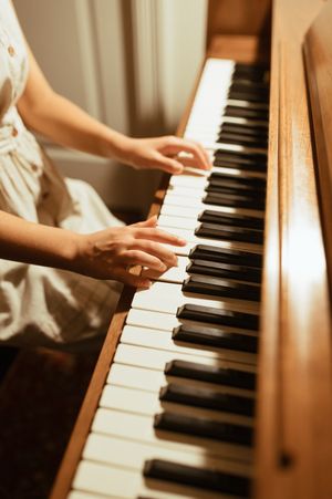 Hands gracefully playing piano keys in warm lighting with multiple artistic angles shown in a collage format.