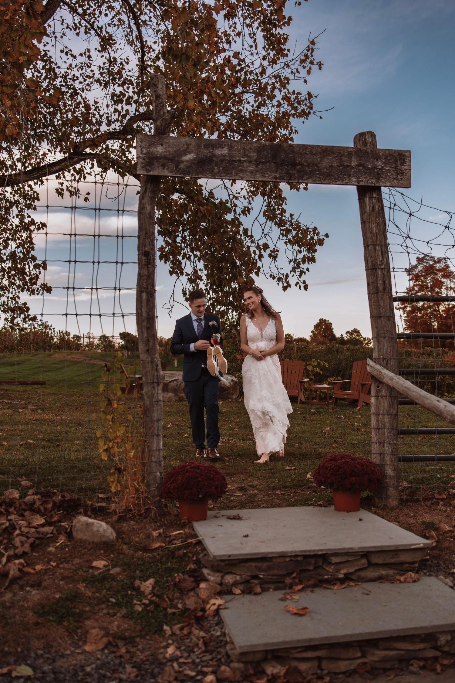Bride and Groom laughing together walking back into the venue sharing a quiet moment together.