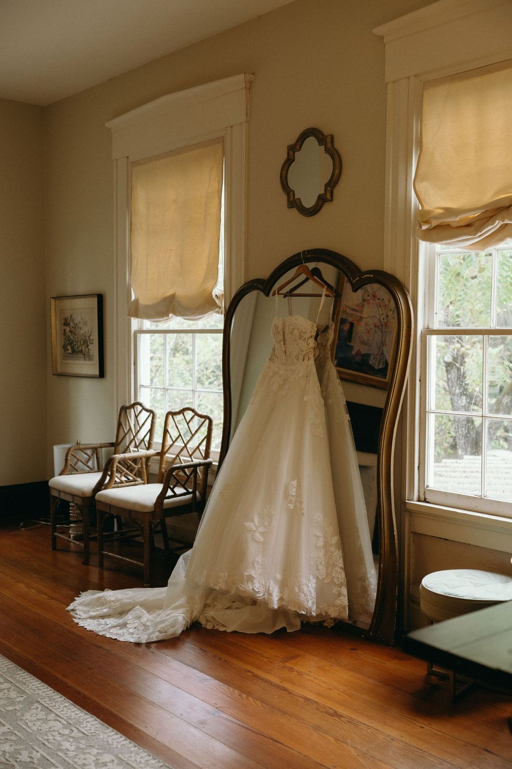 A photograph of a wedding dress in the bridal suite at at The Elms of Coosada in Coosada, Alabama