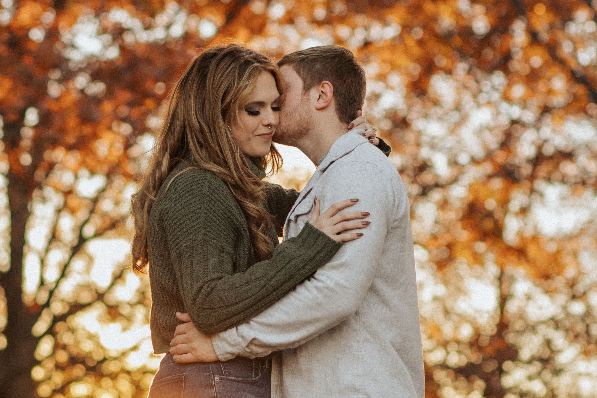 Three romantic portraits of a couple embracing in a warm autumn forest with golden sunlight.