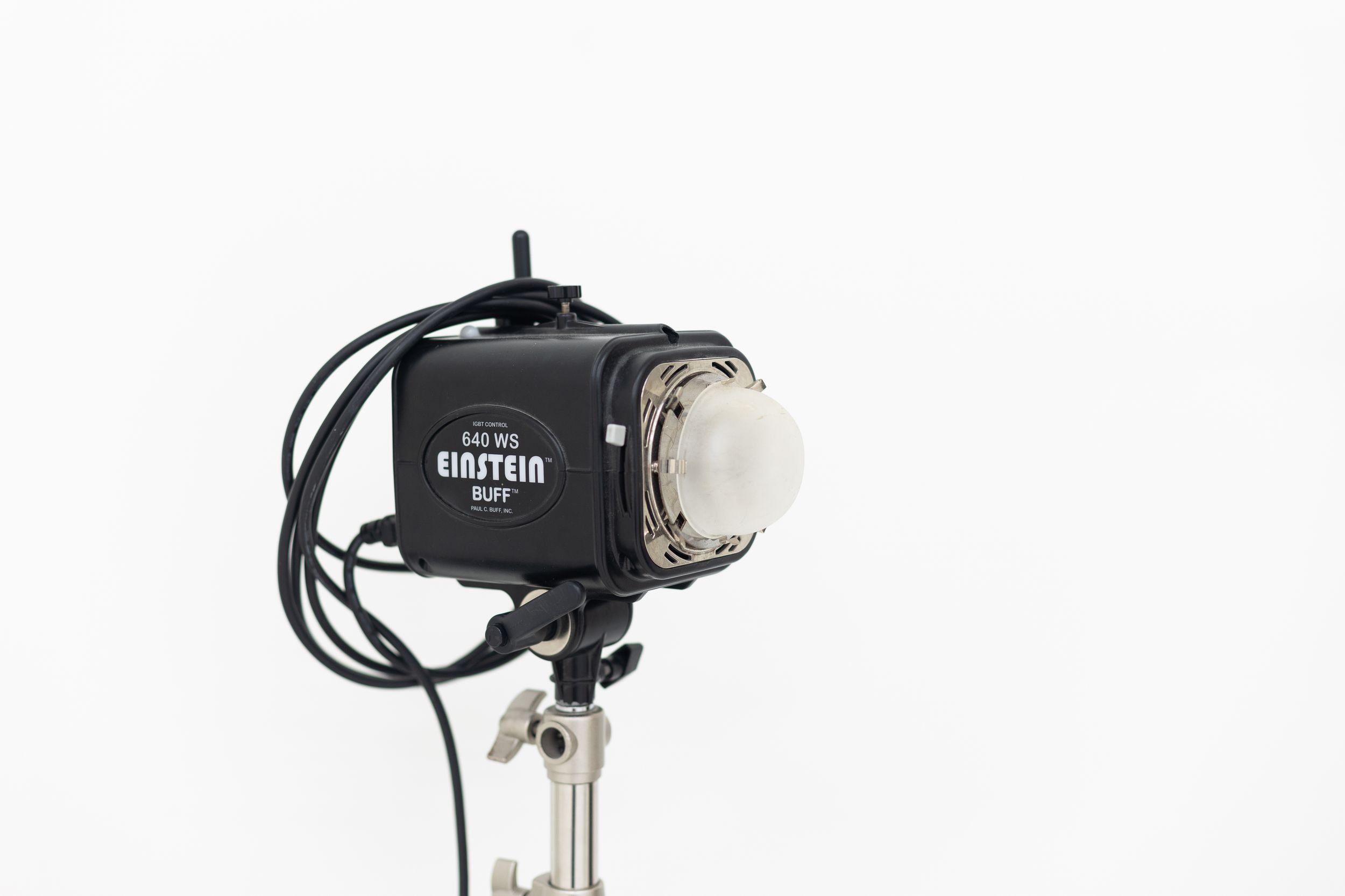 Einstein E640 studio flash monolight on a stand against a white background.