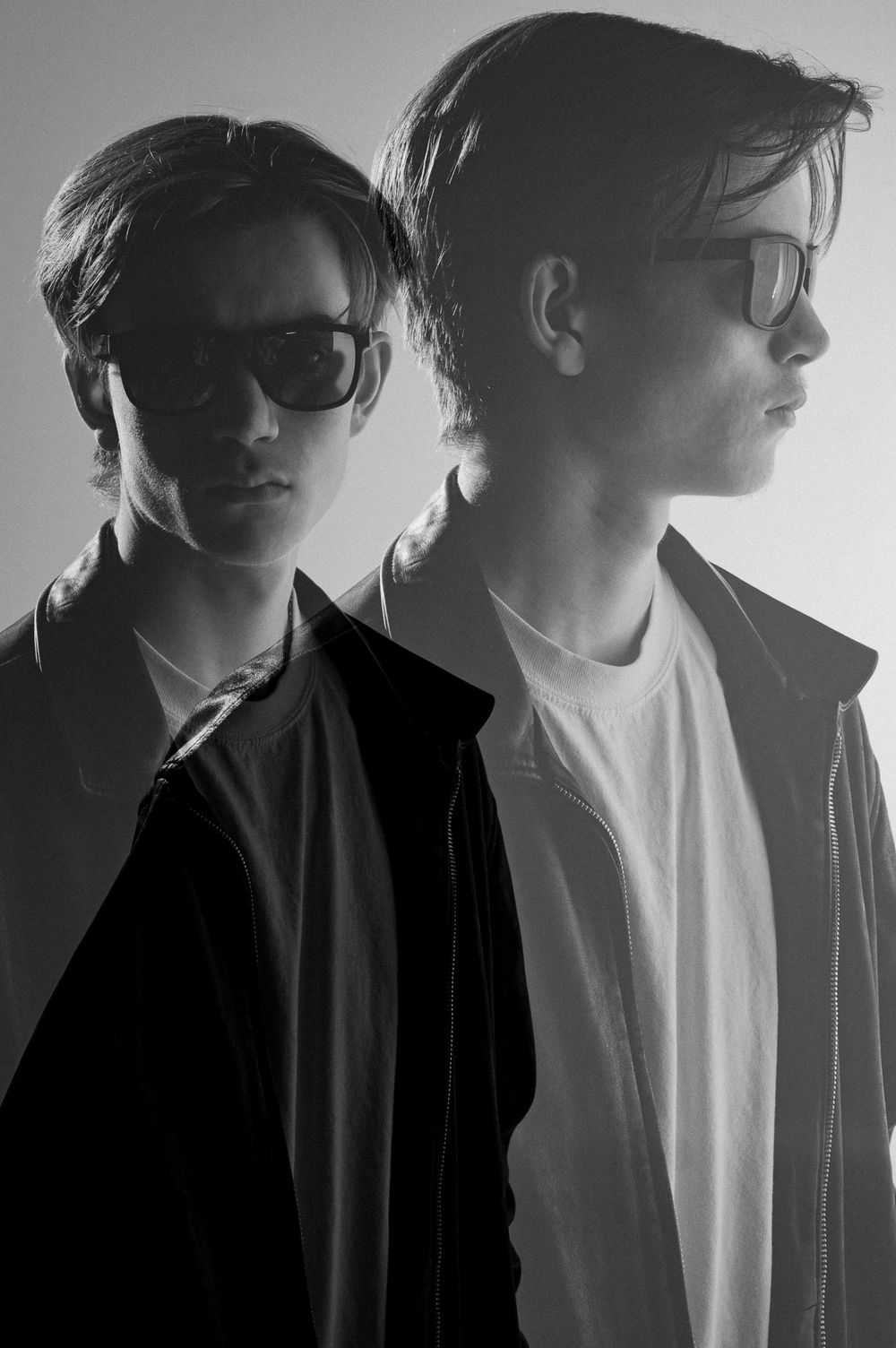 Black and white moody portrait with double exposure.