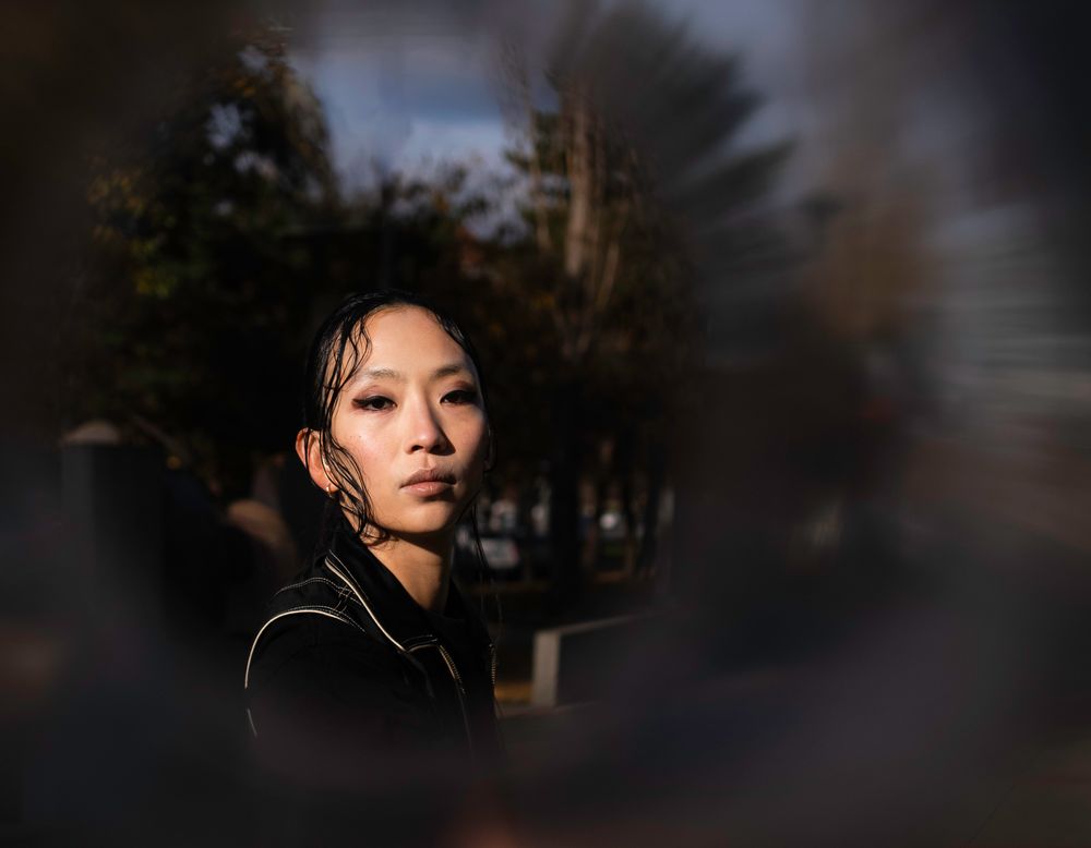 Artistic portrait series captured during golden hour with dramatic lighting and shadows.