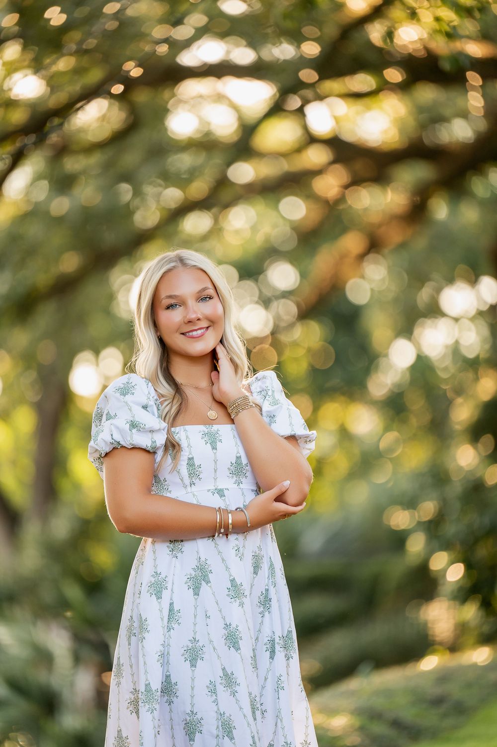 Outdoor portrait with dreamy bokeh lighting and natural garden backdrop.