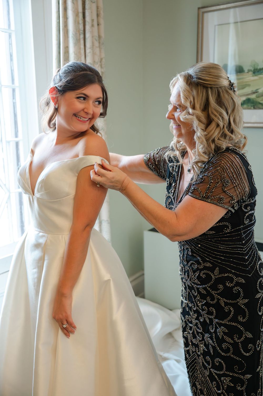 A heartwarming sequence of candid moments between two people sharing laughter and embraces in a sunlit room.